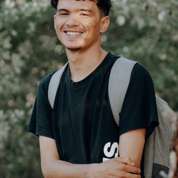 Kaveri Mehta, Lead Design Curator at Nook Ridge Quartz, reviewing corporate floral arrangements